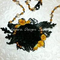 Pretty Black and Gold medium assemblage with vintage rosary chain.